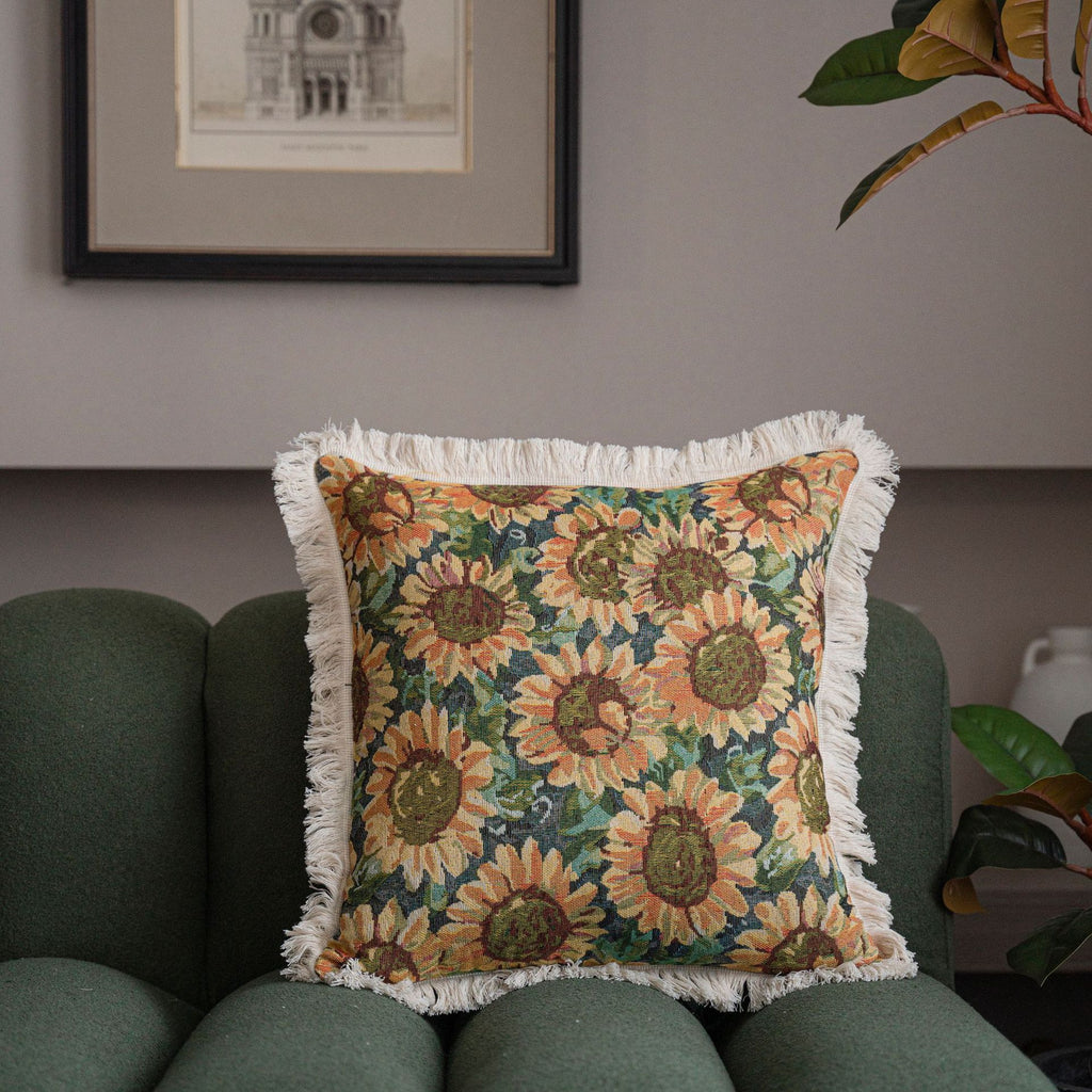 Close-up of jacquard floral throw pillow cover showing intricate woven pattern and decorative tassel trim detail
