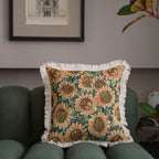 Close-up of jacquard floral throw pillow cover showing intricate woven pattern and decorative tassel trim detail