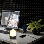 Rechargeable LED atmosphere night light glowing softly on a surface, showcasing its modern minimalist lamp design