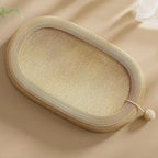 Oval sisal cat scratcher bed with lounge nest design, showing textured scratching surface and cozy raised edges