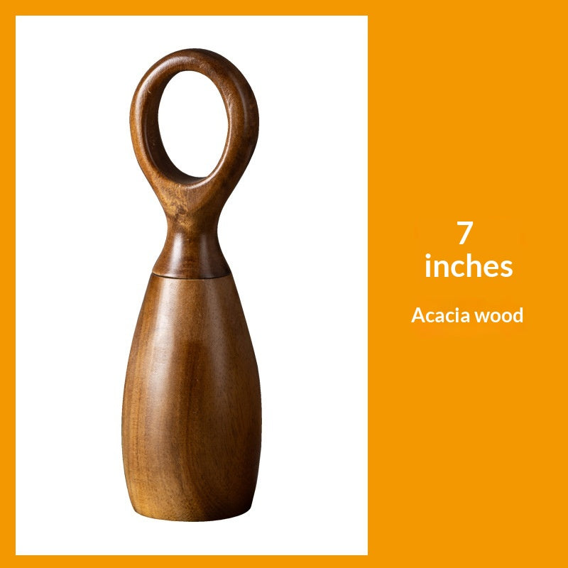 Desert ironwood pepper mill standing upright, showcasing natural wood grain texture with a manual ceramic grinder mechanism