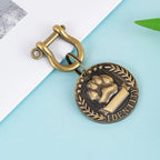 Round silver engraved pet ID tag with custom text, shown close up to display engraving detail