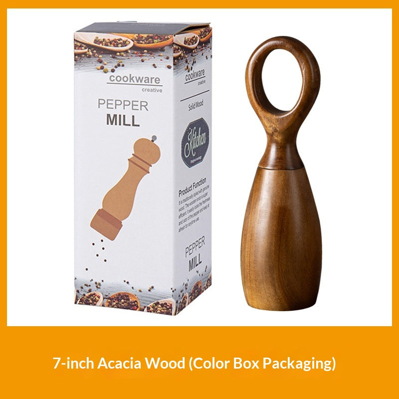 Desert Ironwood pepper mill with manual ceramic grinder, shown from a close-up angle highlighting the natural wood grain and 