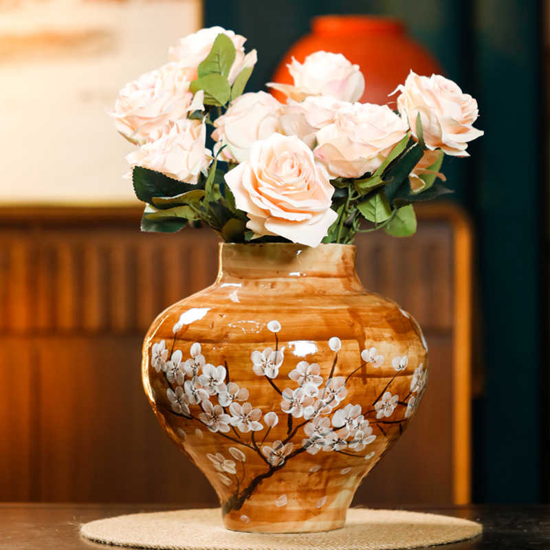 White ceramic hydroponic flower vase with minimalist design, styled as a decorative home accent on a neutral surface