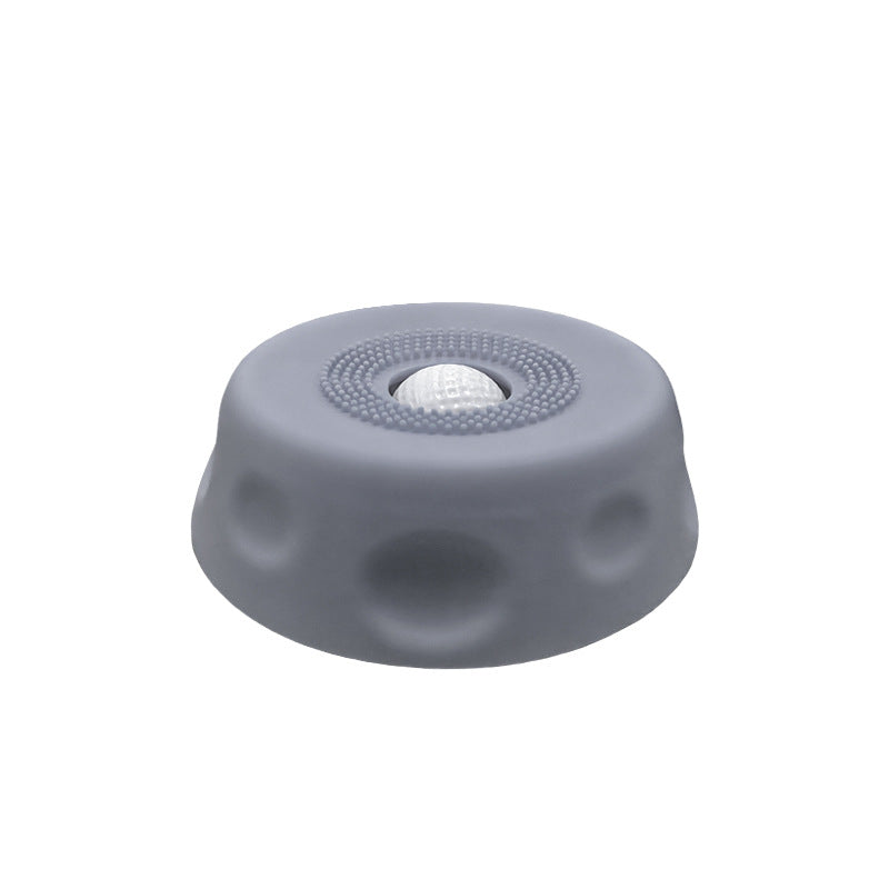 Dog slow feeder lick bowl with rolling ball shown from above, featuring textured surface and interactive ball insert