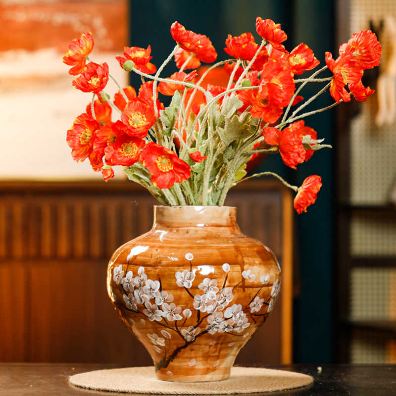 White ceramic hydroponic vase with minimalist design, styled as a decorative home accent for fresh or dried flowers
