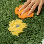 Soft area rug with floral and plant print pattern, shown flat with non-slip backing detail for home flooring