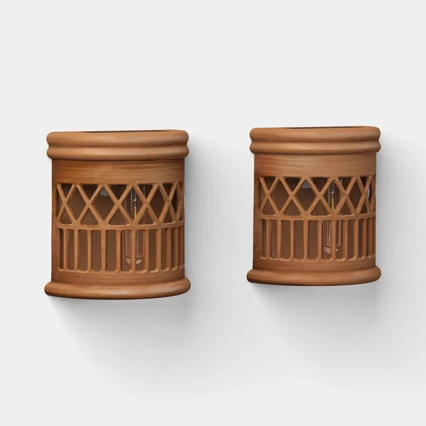 Two solar woven deck accent lights with warm filament LED glow, placed on wooden deck boards at dusk