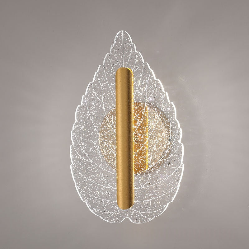 Modern minimalist leaf-shaped wall sconce with tri-color LED lighting, shown mounted indoors against a neutral wall