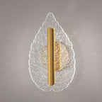 Modern minimalist leaf-shaped wall sconce with tri-color LED lighting, shown mounted indoors against a neutral wall