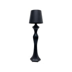 Warm light table lamp casting a soft amber glow on a bedside table, ideal for bedroom decor and nighttime ambiance.