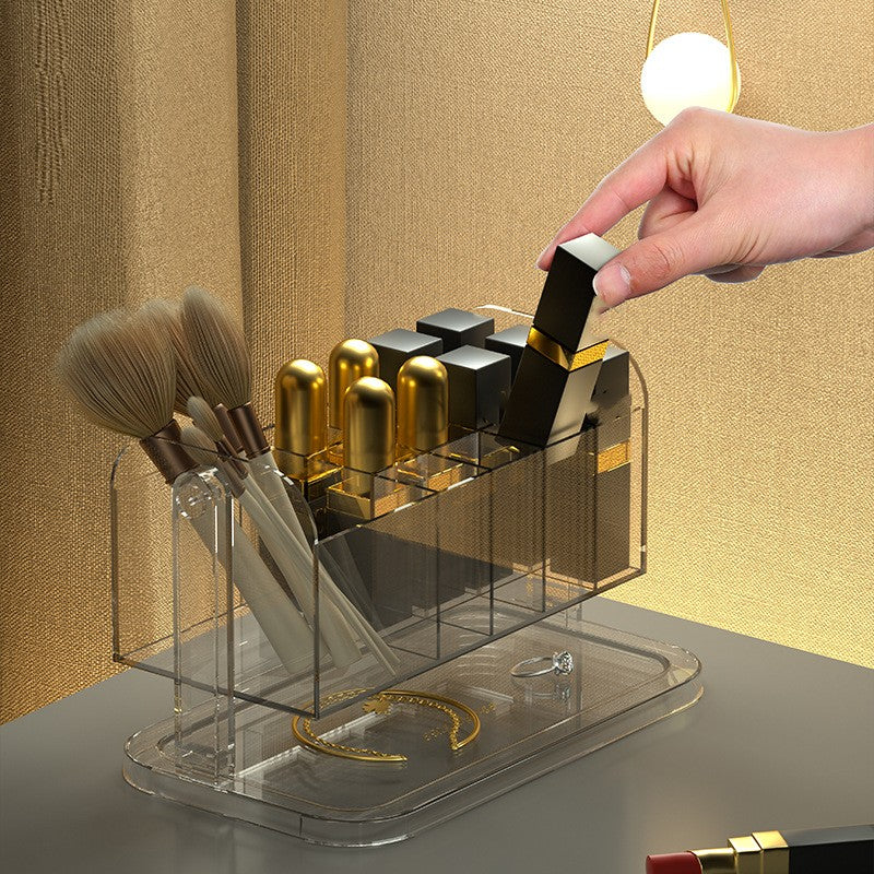 Clear PET rotating makeup organizer box holding lipstick tubes and brushes, showing full 360-degree swivel base from side ang