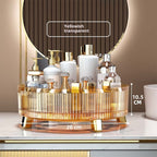 Clear rotating desktop storage box open to show multiple compartments organized with small accessories and stationery items