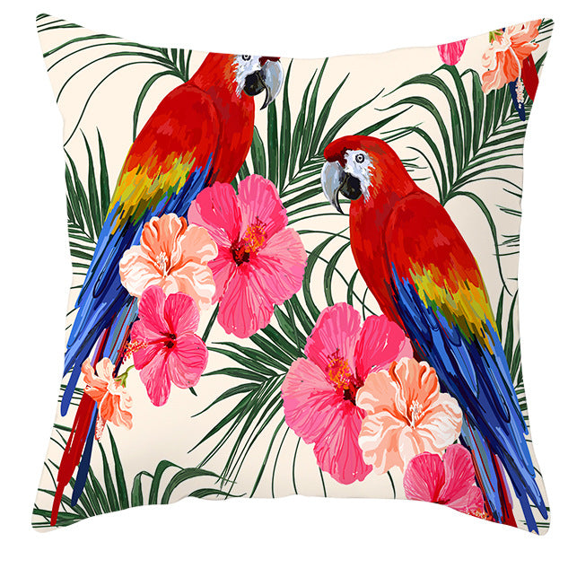 Tropical parrot and plant print throw pillow cover laid flat, showing vibrant botanical pattern on a 45x45cm cushion cover