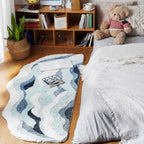 Fluffy wave-shaped bath mat in soft neutral tones, shown flat to display absorbent texture and non-slip bathroom rug design