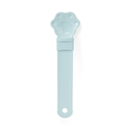 Cat treat squeeze spoon lickable feeder dispenser shown from the side, highlighting the soft silicone tip and squeezable hand