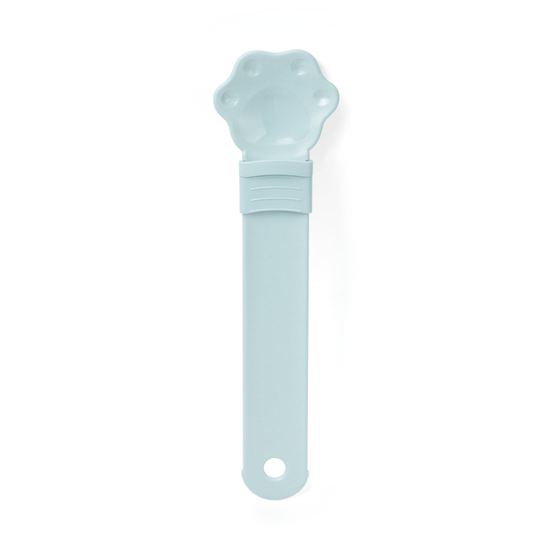 Cat treat squeeze spoon lickable feeder dispenser shown from the side, highlighting the soft silicone tip and squeezable hand