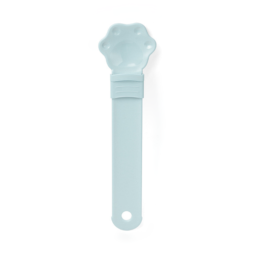 Cat treat squeeze spoon lickable feeder dispenser shown from the side, highlighting the soft silicone tip and squeezable hand