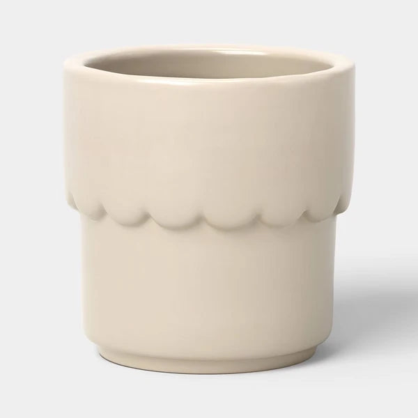 Cream ceramic planter pot with drainage hole, ideal for succulents and small outdoor plants