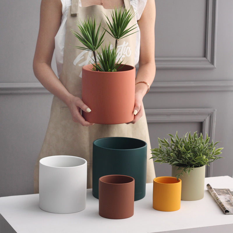 Colorful Nordic ceramic cylinder succulent planter with drainage hole, featuring a minimalist design in soft pastel tones