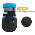 Close-up of water-resistant non-slip dog boots on a medium to large dog's paws, showing secure fit and durable sole